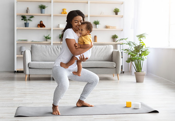 mom doing exercises with infant