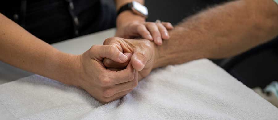 Hand therapist treating patient