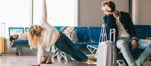 Woman doing yoga in airport