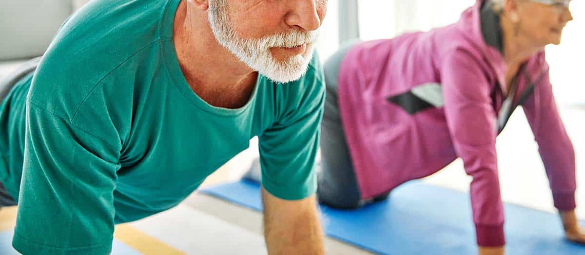 Older Man and Woman Stretching