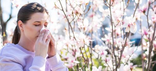 Woman with Seasonal Allergies Sneezing